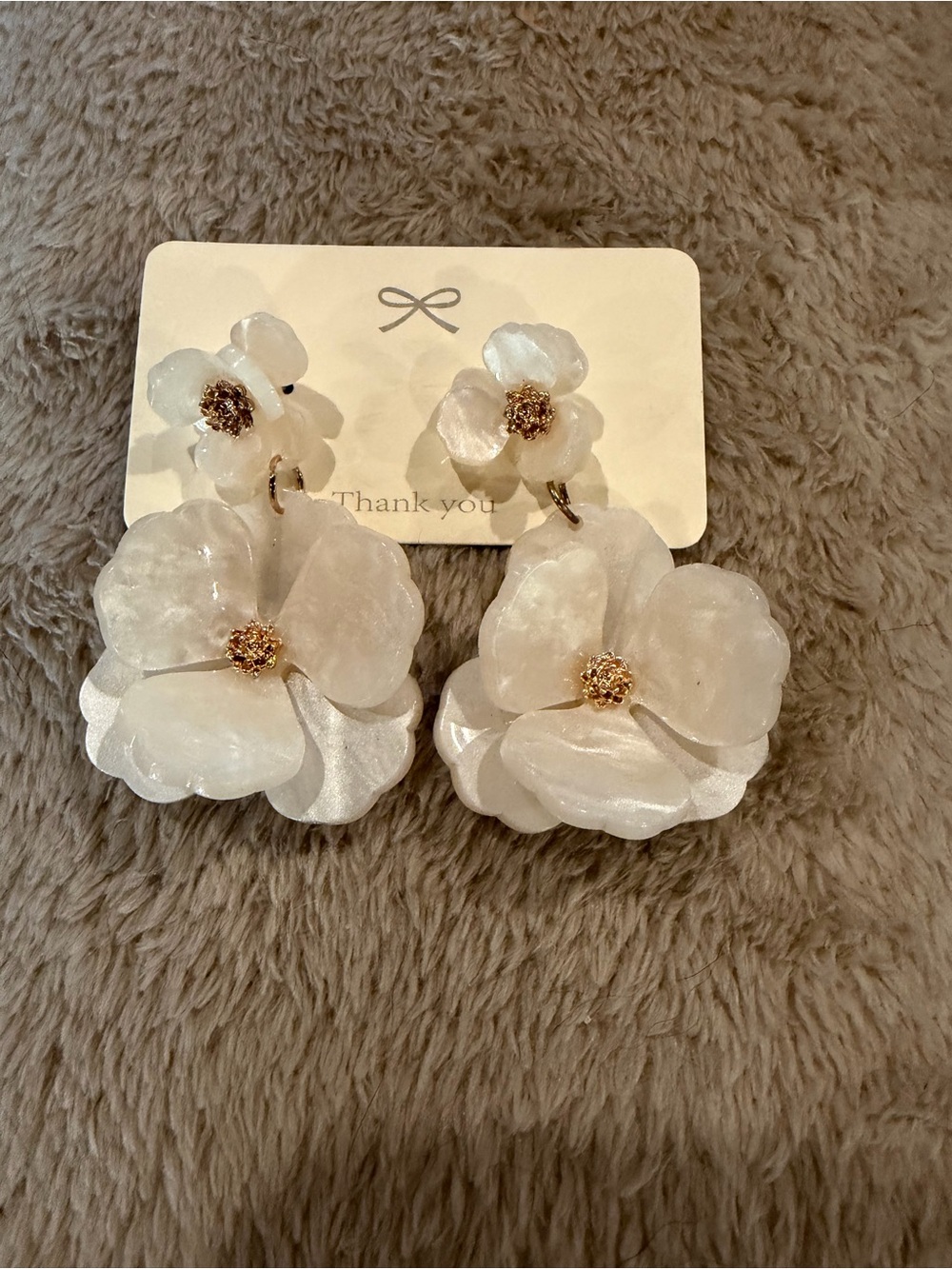 Floral statement earrings in white